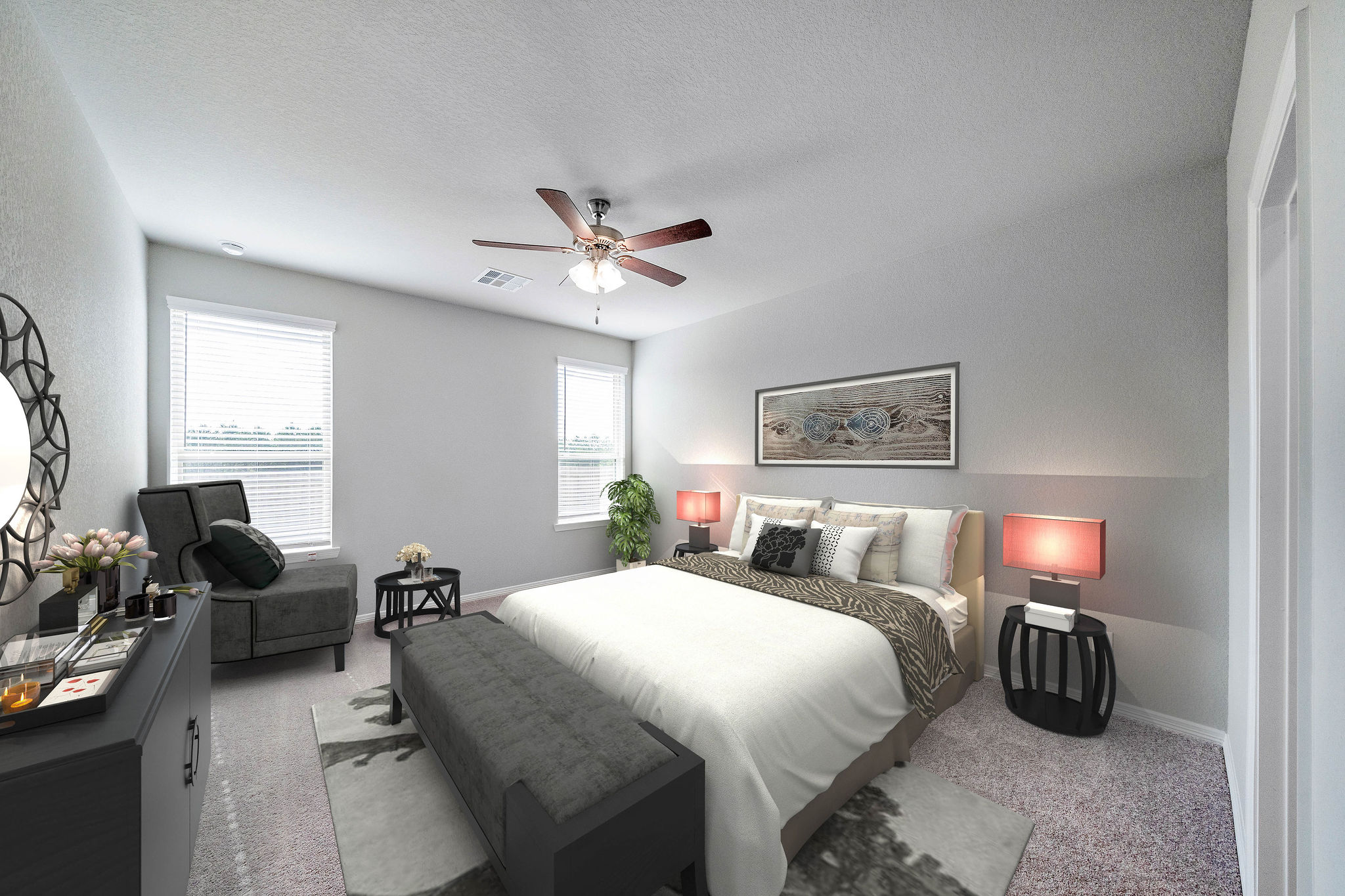 A bedroom with a bed and a fan.