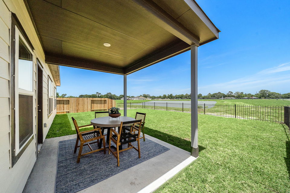 A table and chairs on a deck.