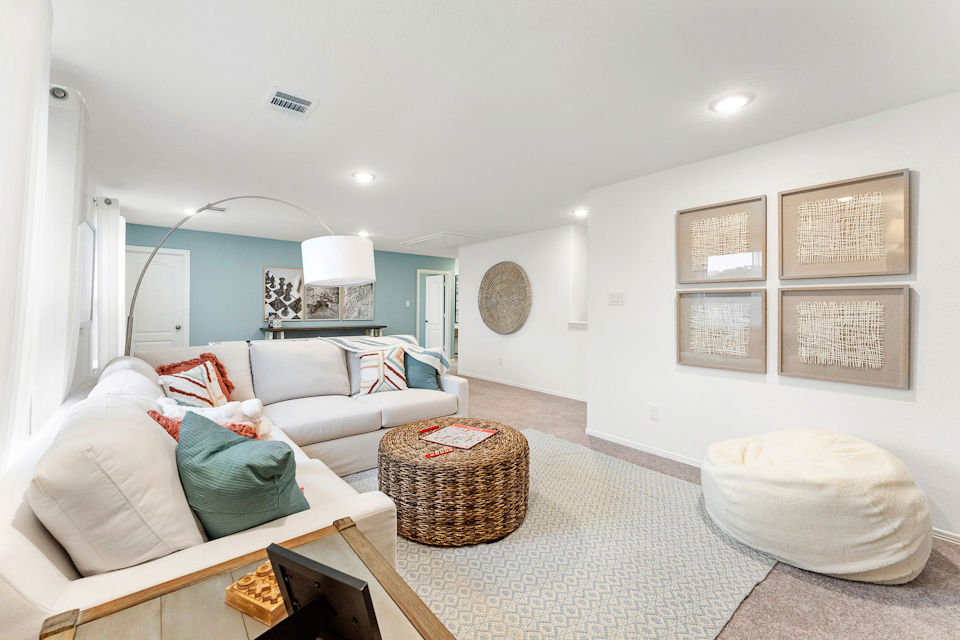 A living room with a couch and a table.