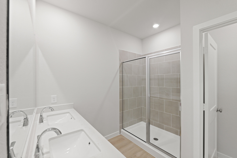 A bathroom with a glass shower.