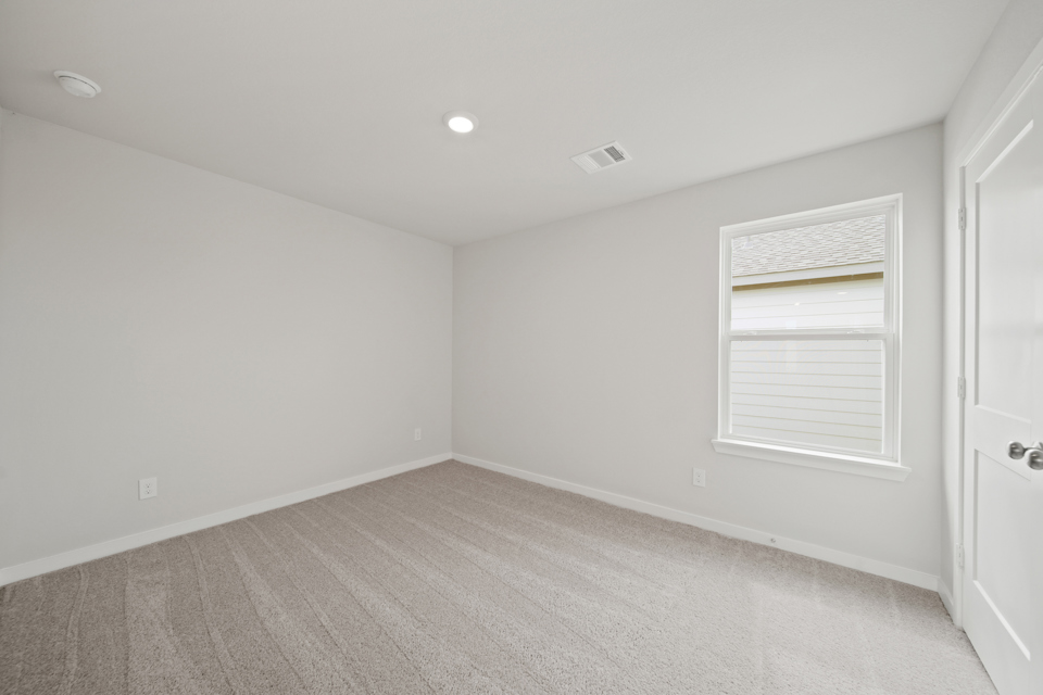 A room with a door and a window.