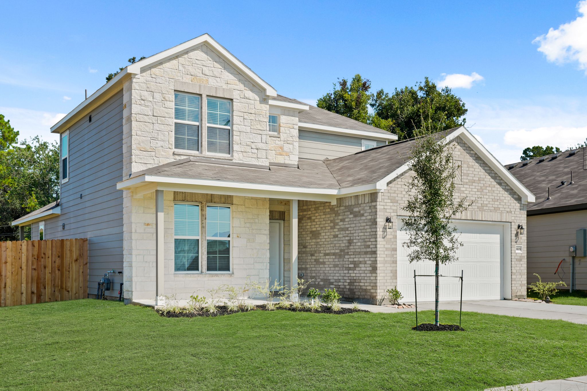 A house with a yard and trees.