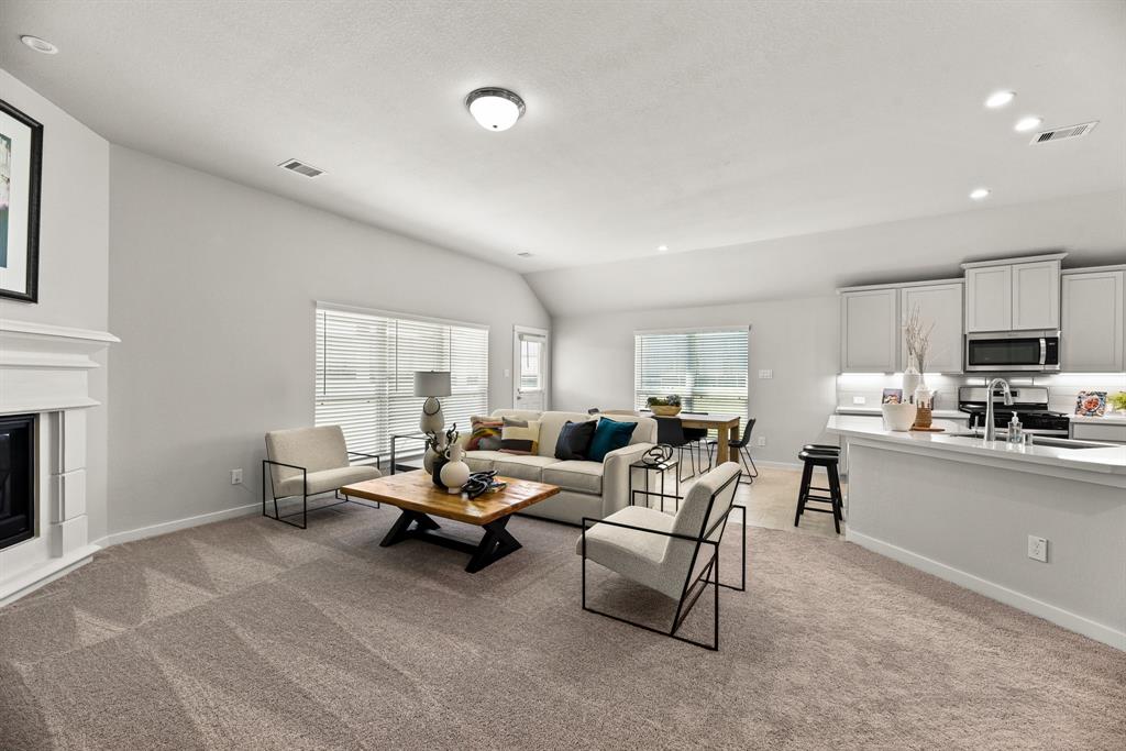 A living room with a couch and a table.