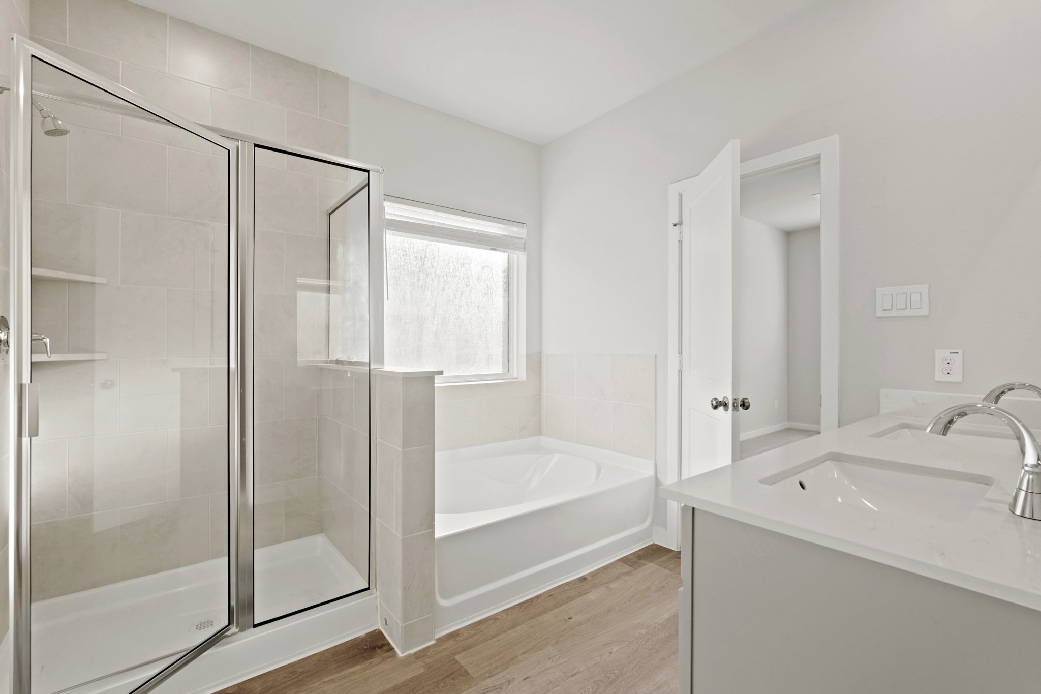 A bathroom with a glass shower.
