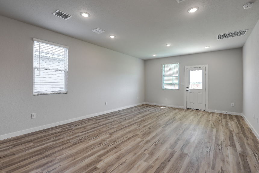 A room with a wood floor and a wood floor.