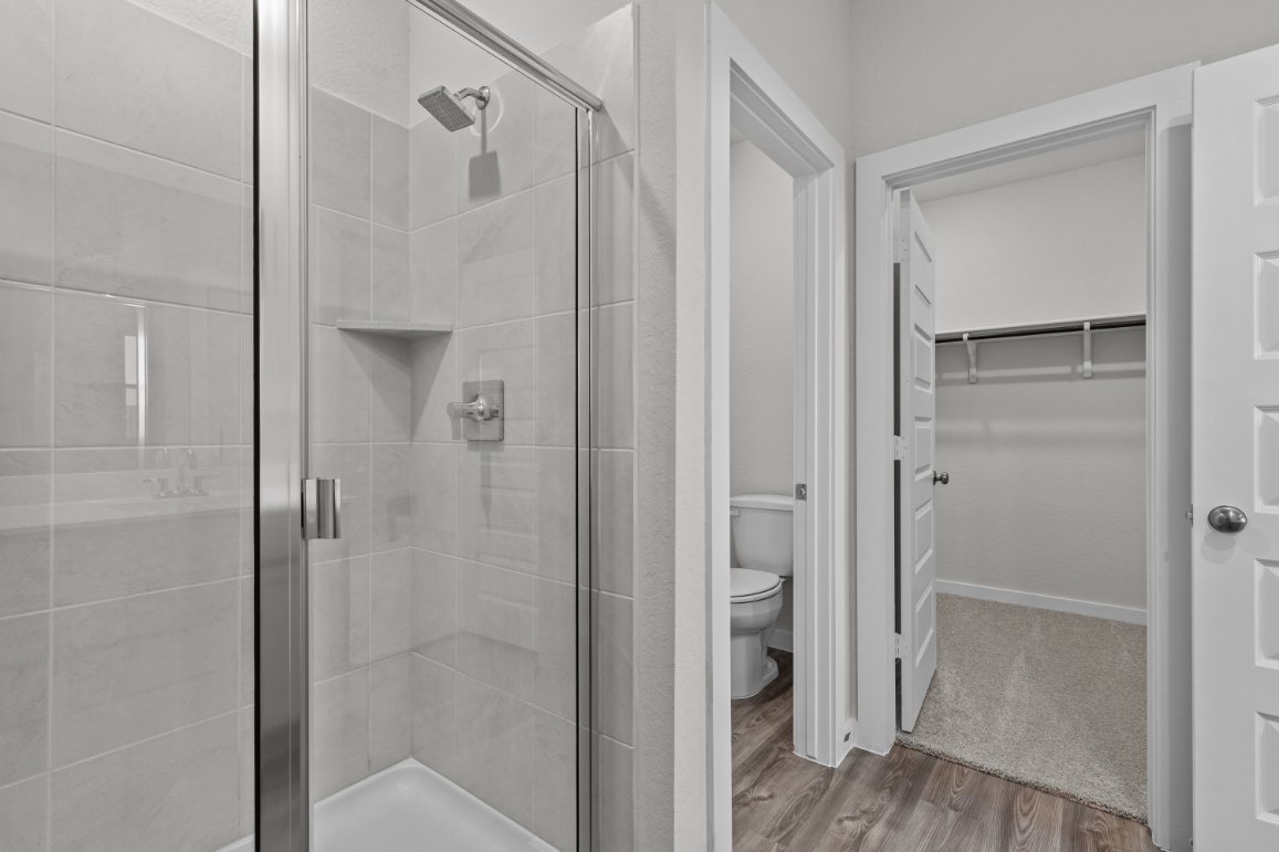 A bathroom with a glass shower.