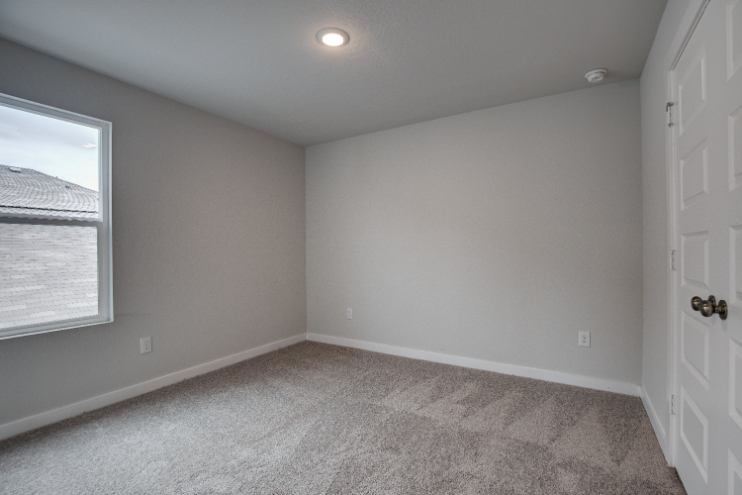 A room with a door and a window.