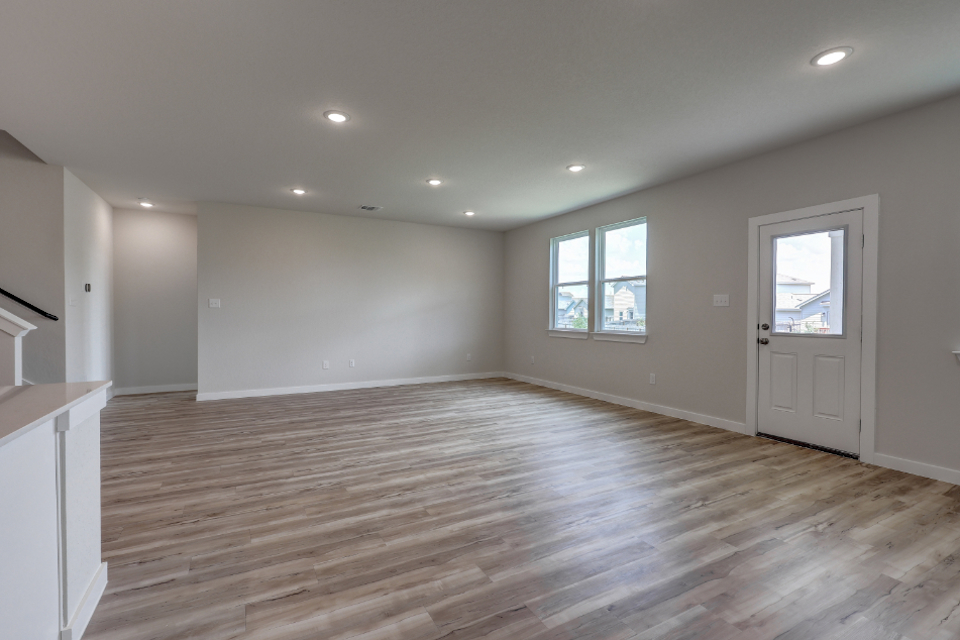 A room with a wood floor and a wood floor.