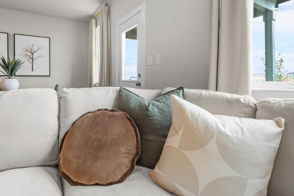 A couch with pillows.