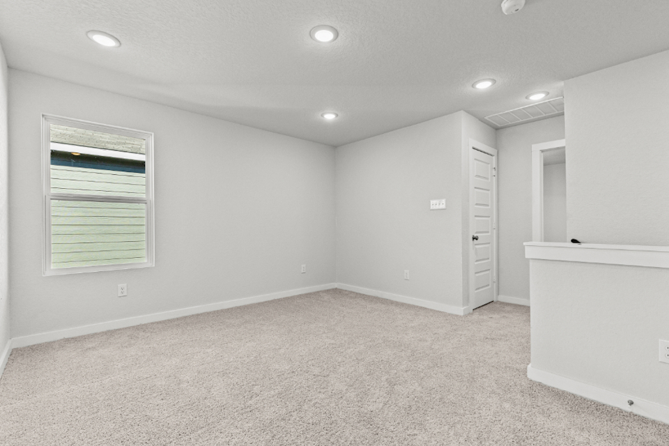 A room with white walls and a white cabinet.