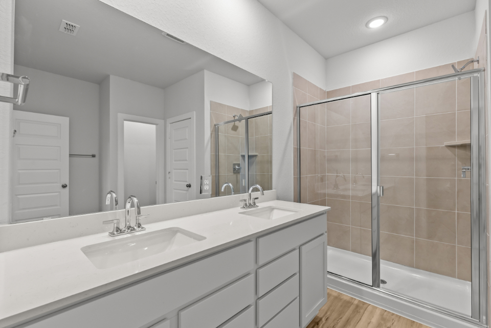 A bathroom with a glass shower.