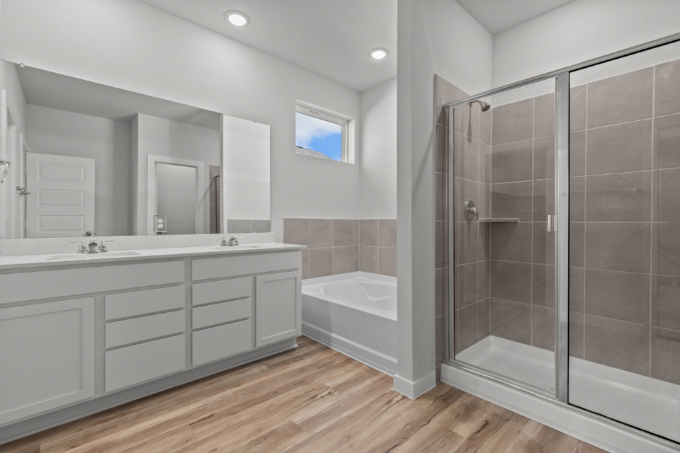 A bathroom with a glass shower.