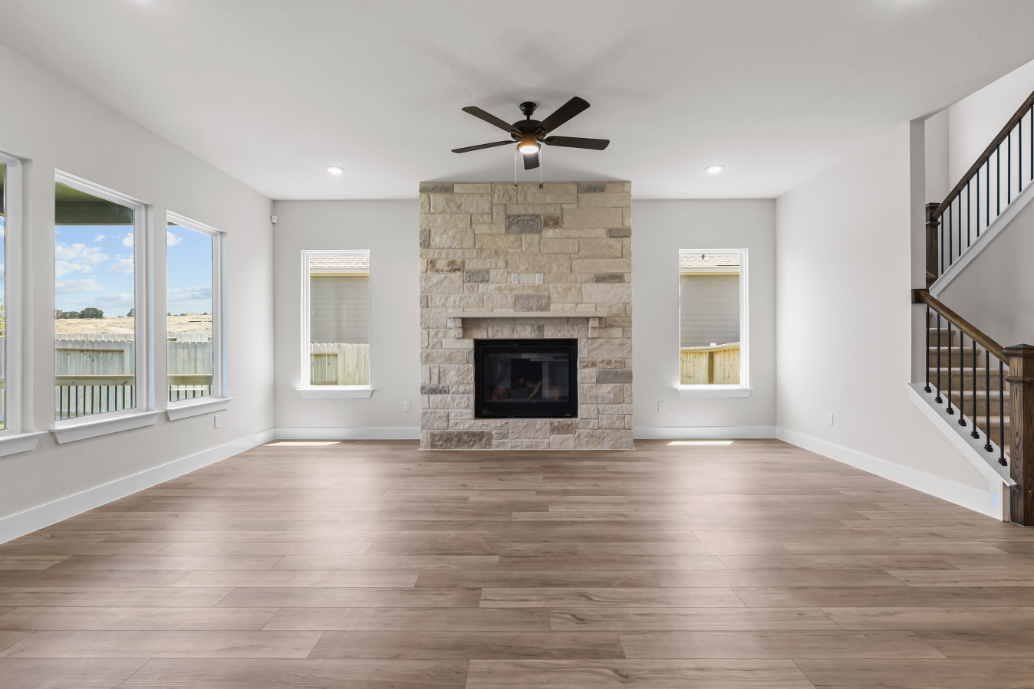 A large living room with a fireplace.