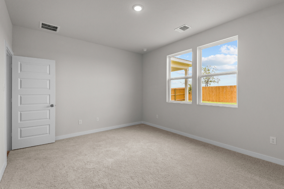 A room with a window and a door.