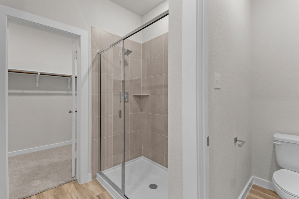 A bathroom with a glass shower.