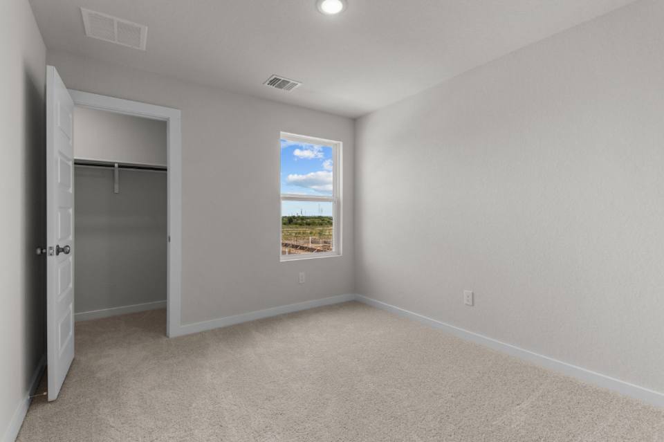 A room with a window and a door.