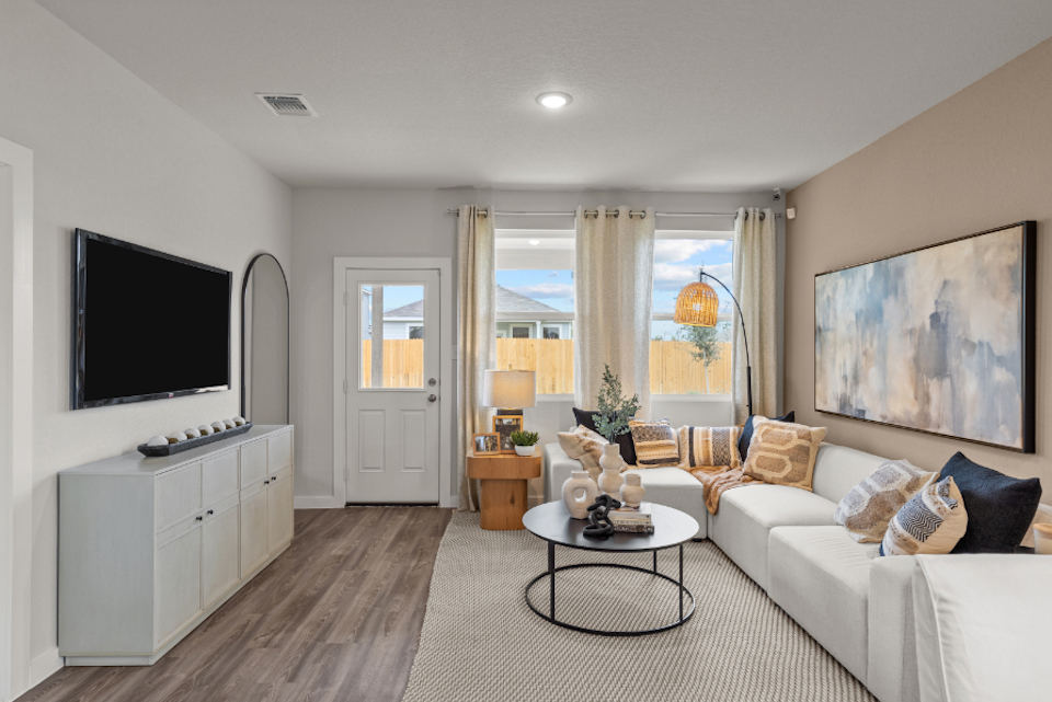 A living room with a tv and couches.