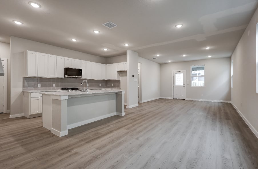 A large kitchen with white cabinets.