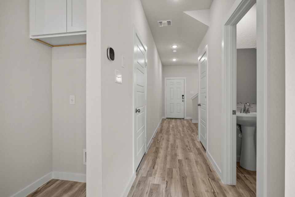 A bathroom with white walls.