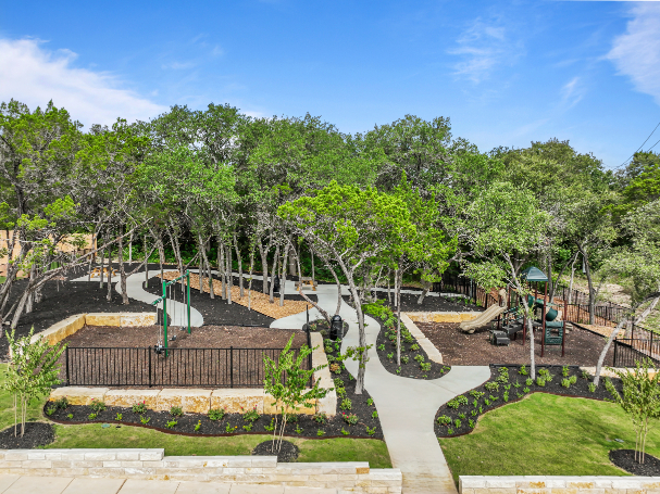 A park with trees and a playground.