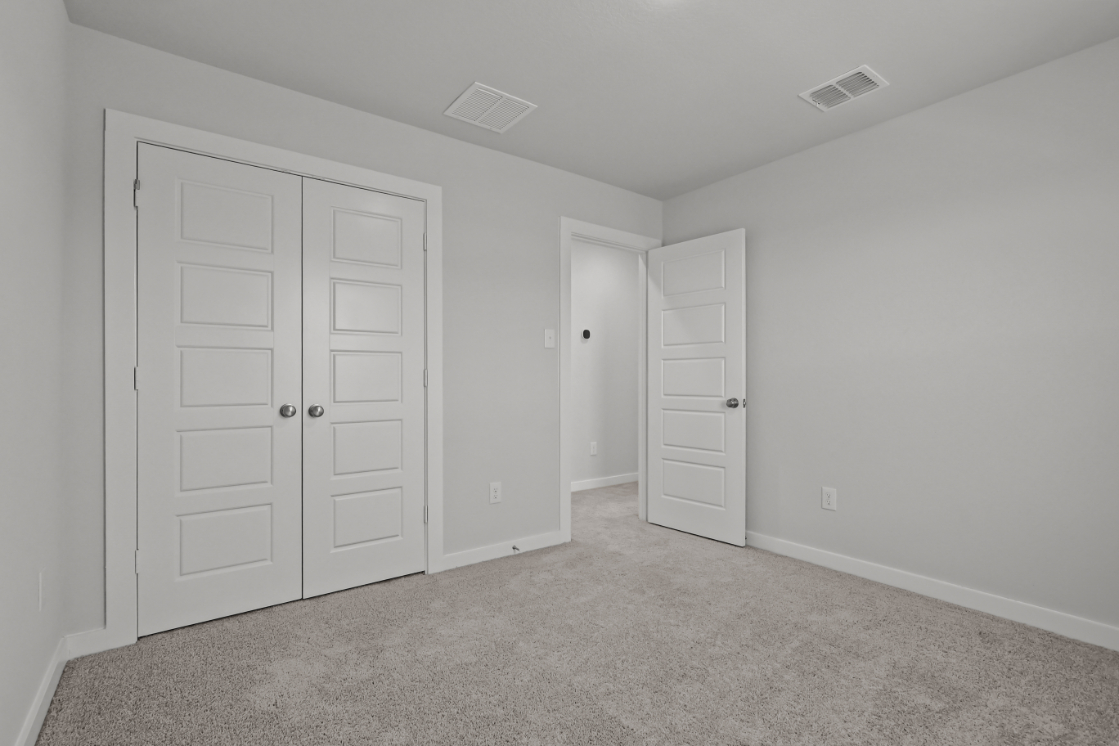 A room with white doors.