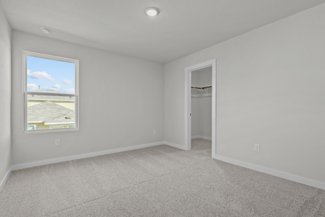 A room with a window and a door.