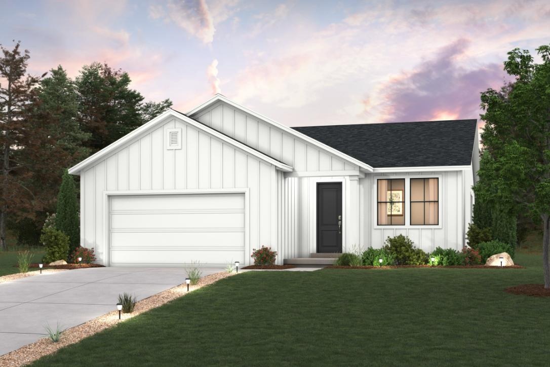 A white house with a green lawn.