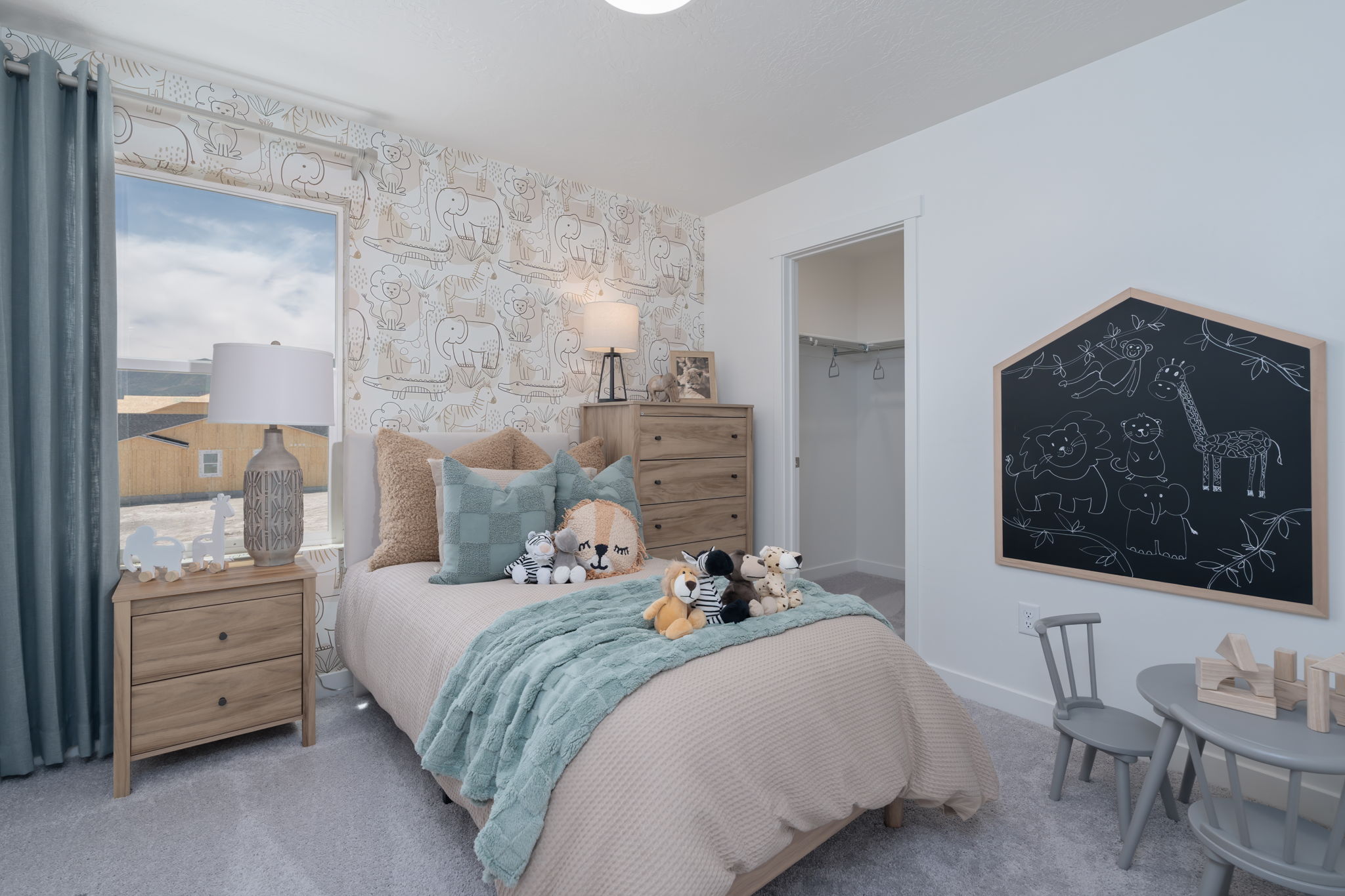 A bedroom with a bed and a mirror.