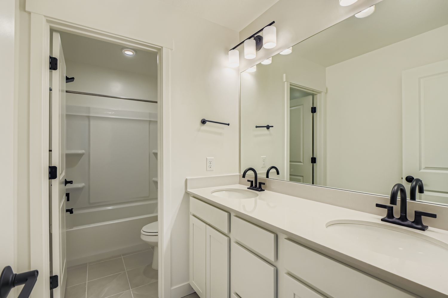 A bathroom with a glass shower.