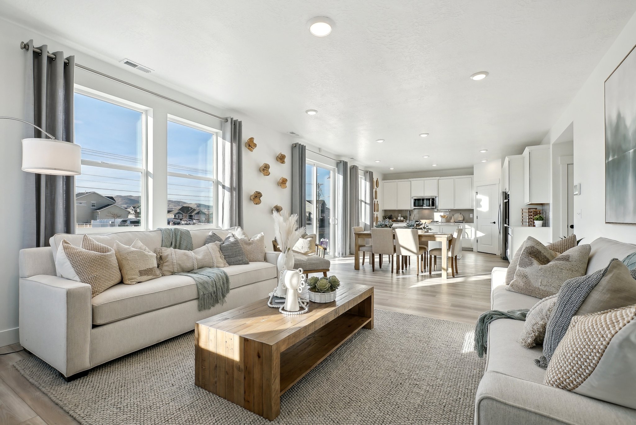 A large living room with a large window.