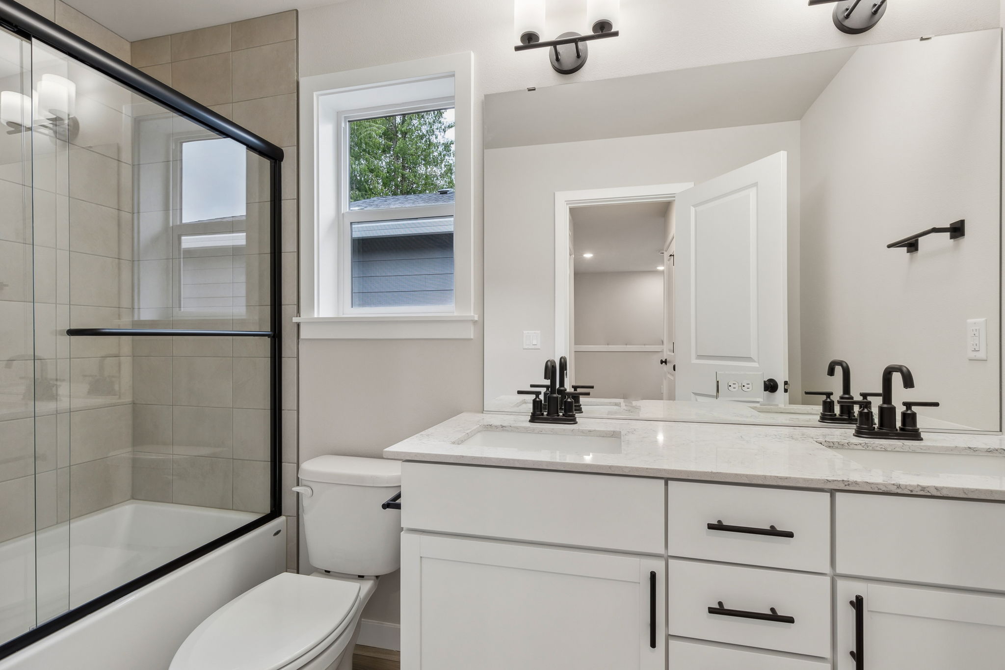 A bathroom with a glass shower.