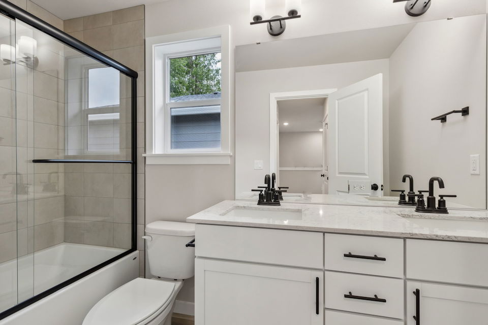 A bathroom with a glass shower.