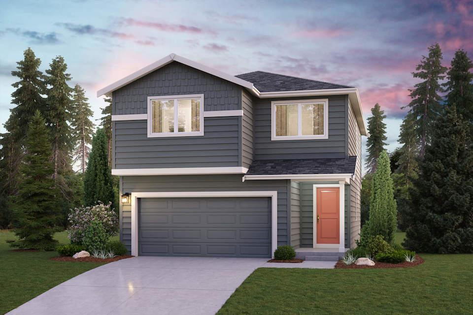 A house with a garage and trees around it.