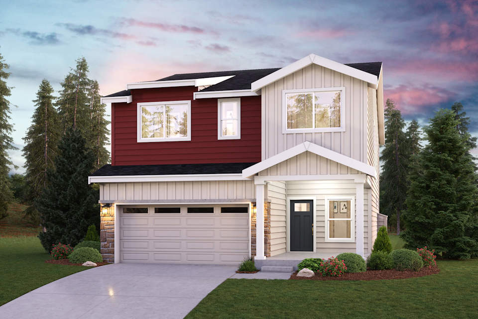 A house with a garage and trees around it.