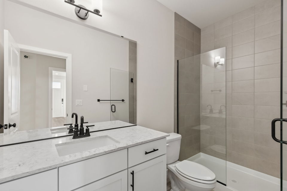 A bathroom with a glass shower.