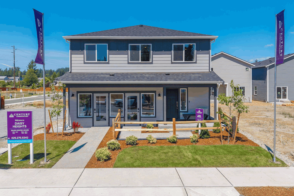 A house with a sign in front.