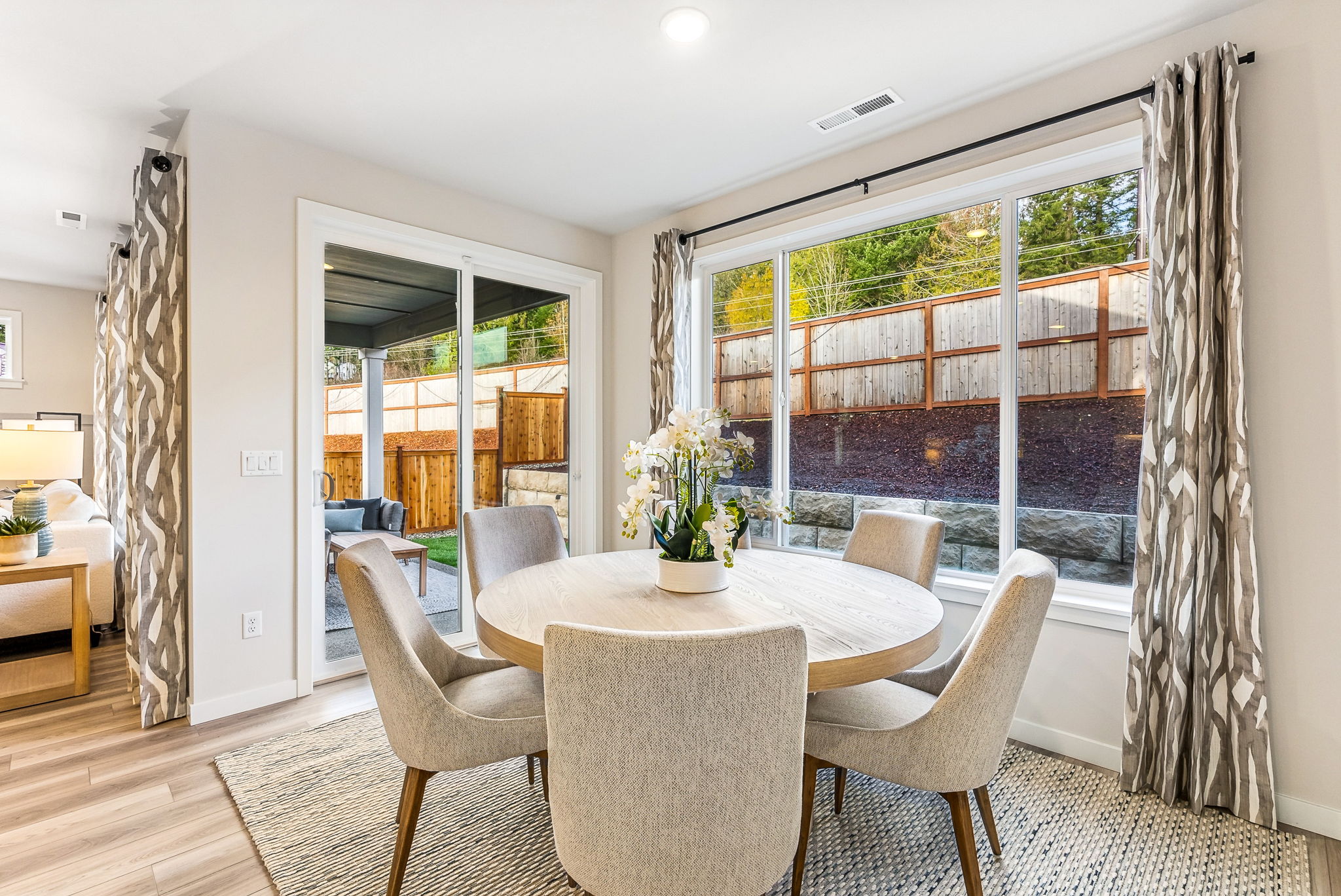A dining room with a large window.