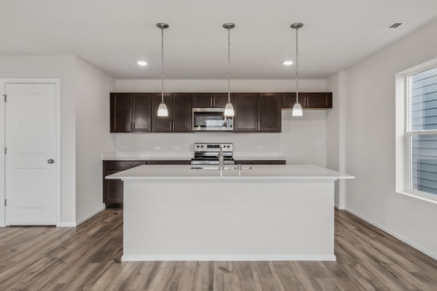 A kitchen with a white counter top.