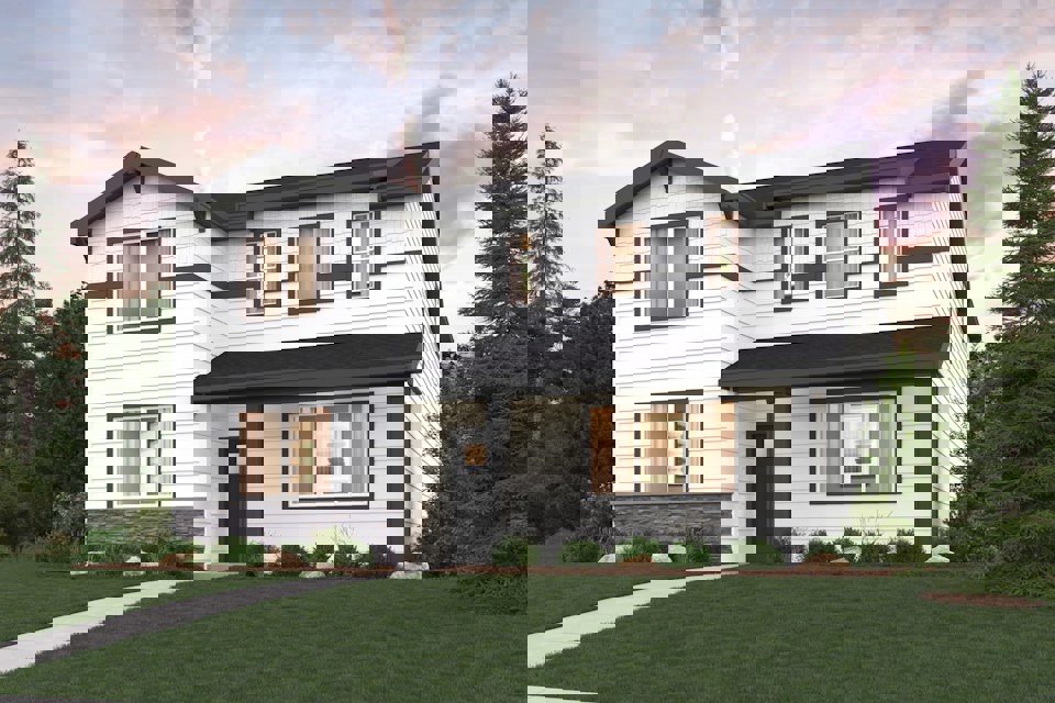 A house with a lawn in front of it.