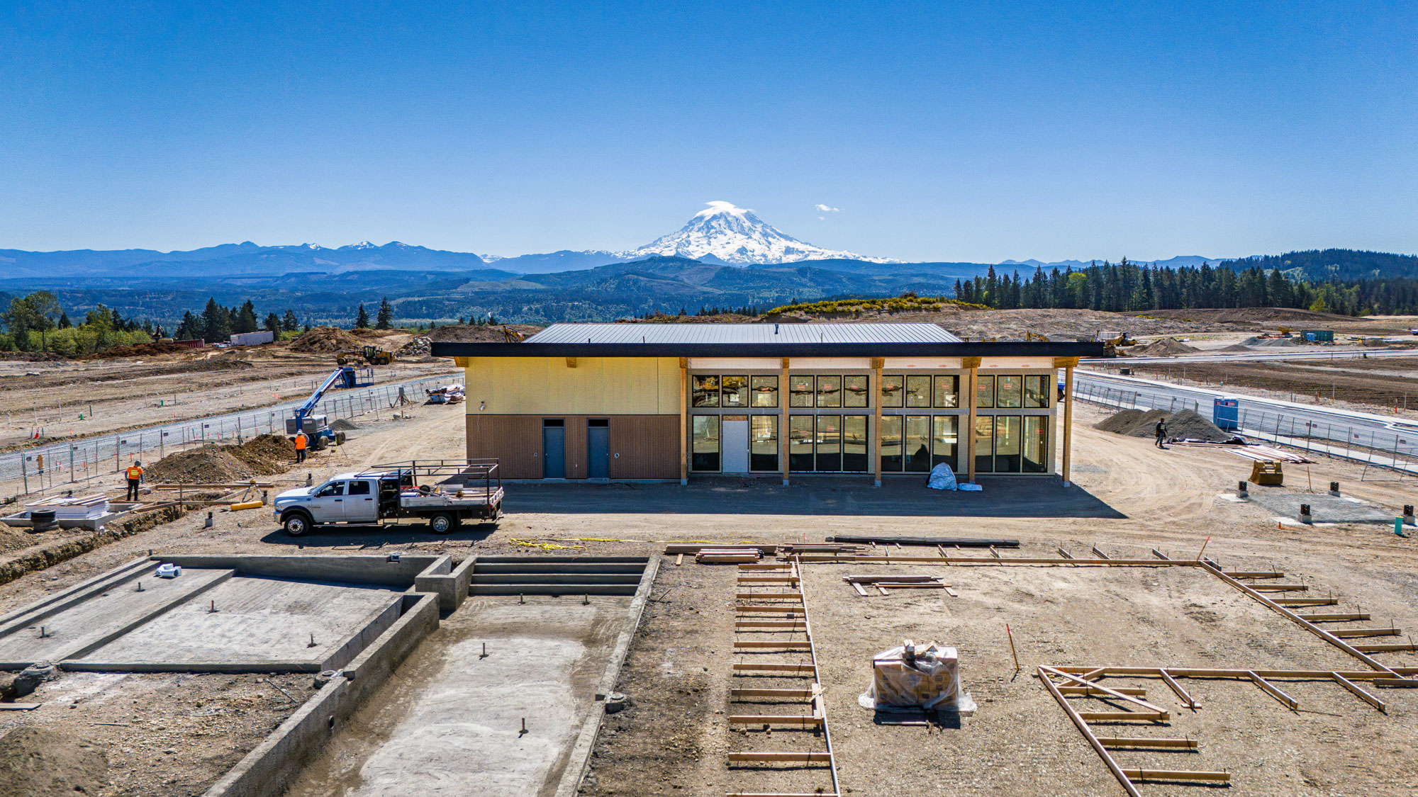 A building with a mountain in the background.