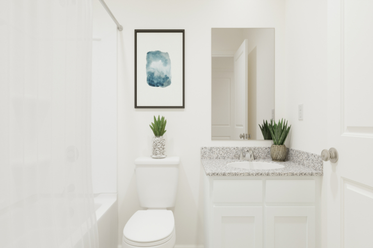 A bathroom with a toilet and a sink.