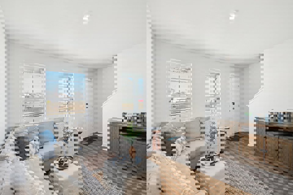 A living room with a couch and a table.