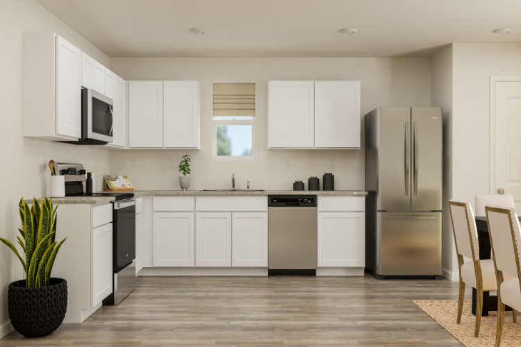 A kitchen with white cabinets.