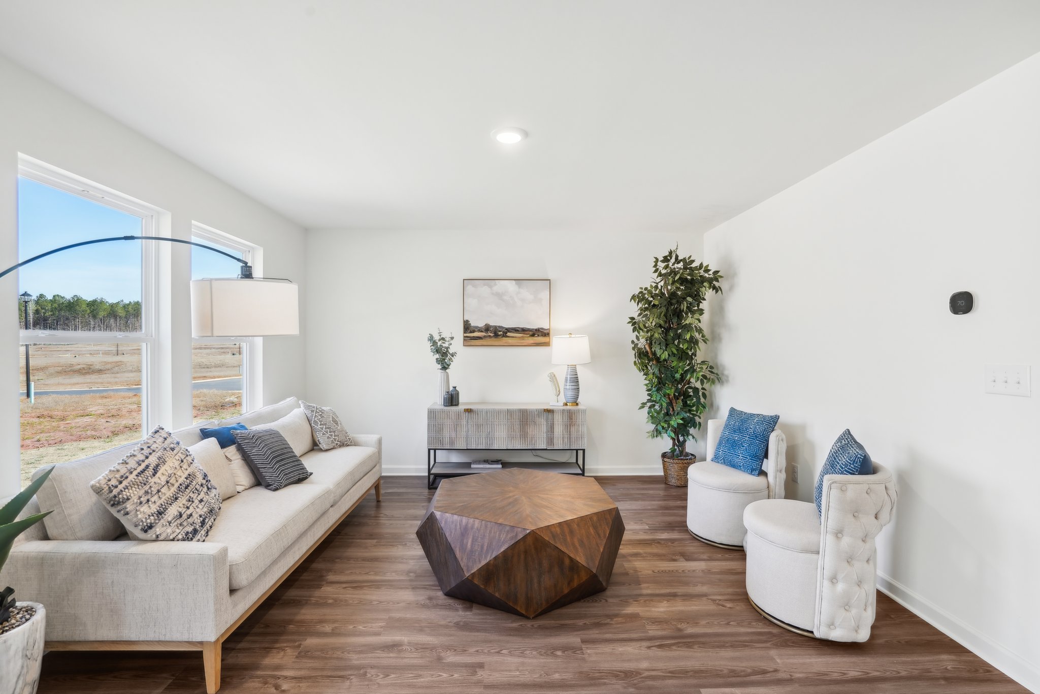 A living room with a large glass door.