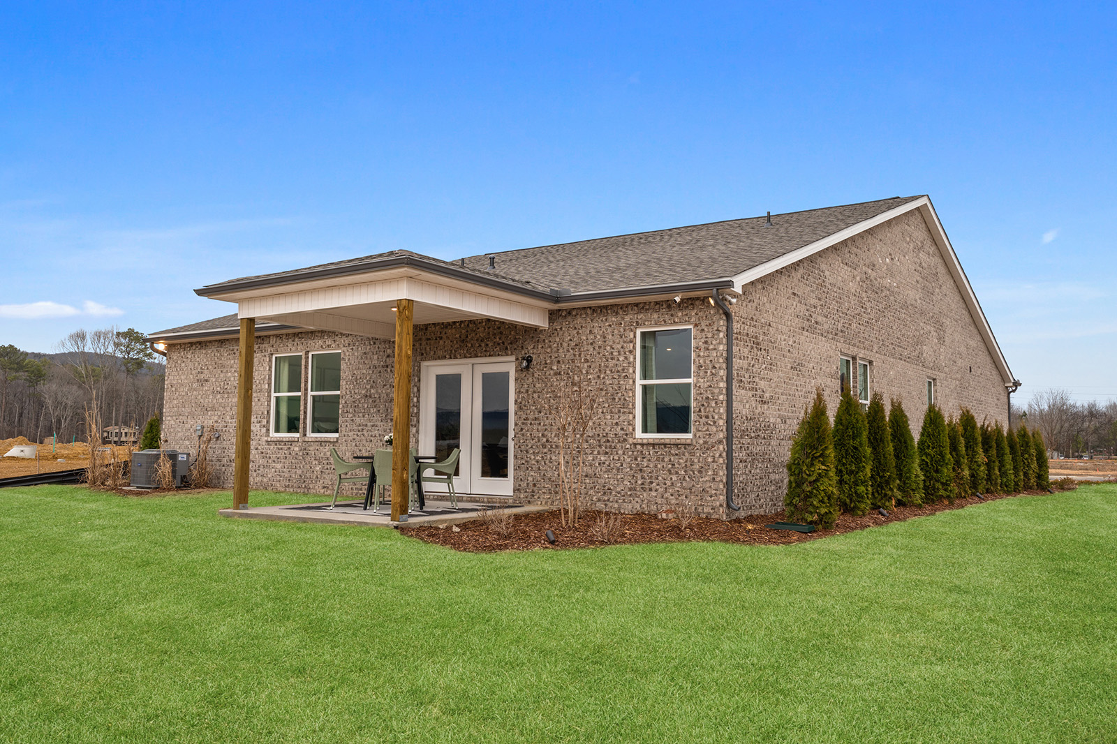 A house with a grass yard.