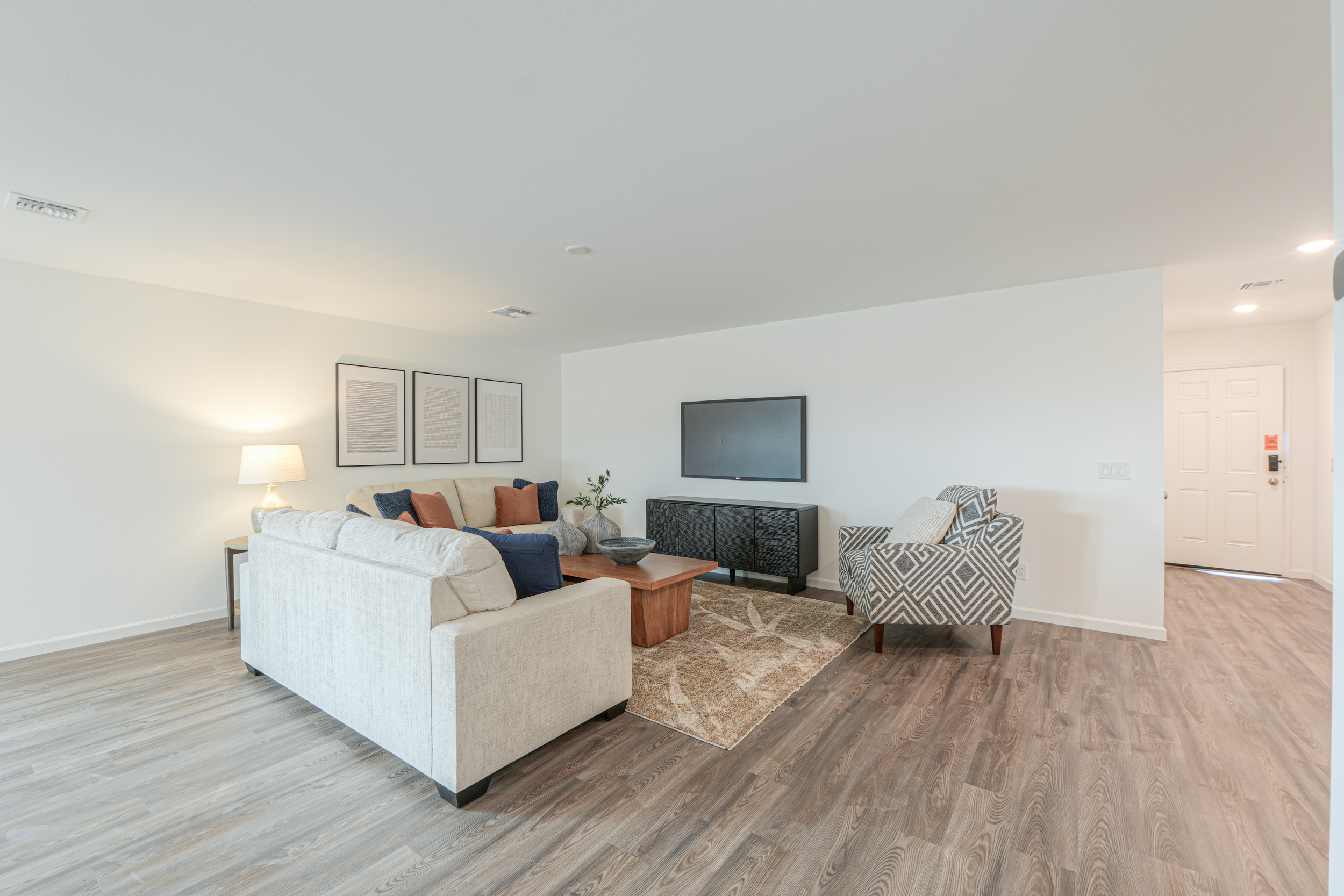 A living room with a tv and couches.