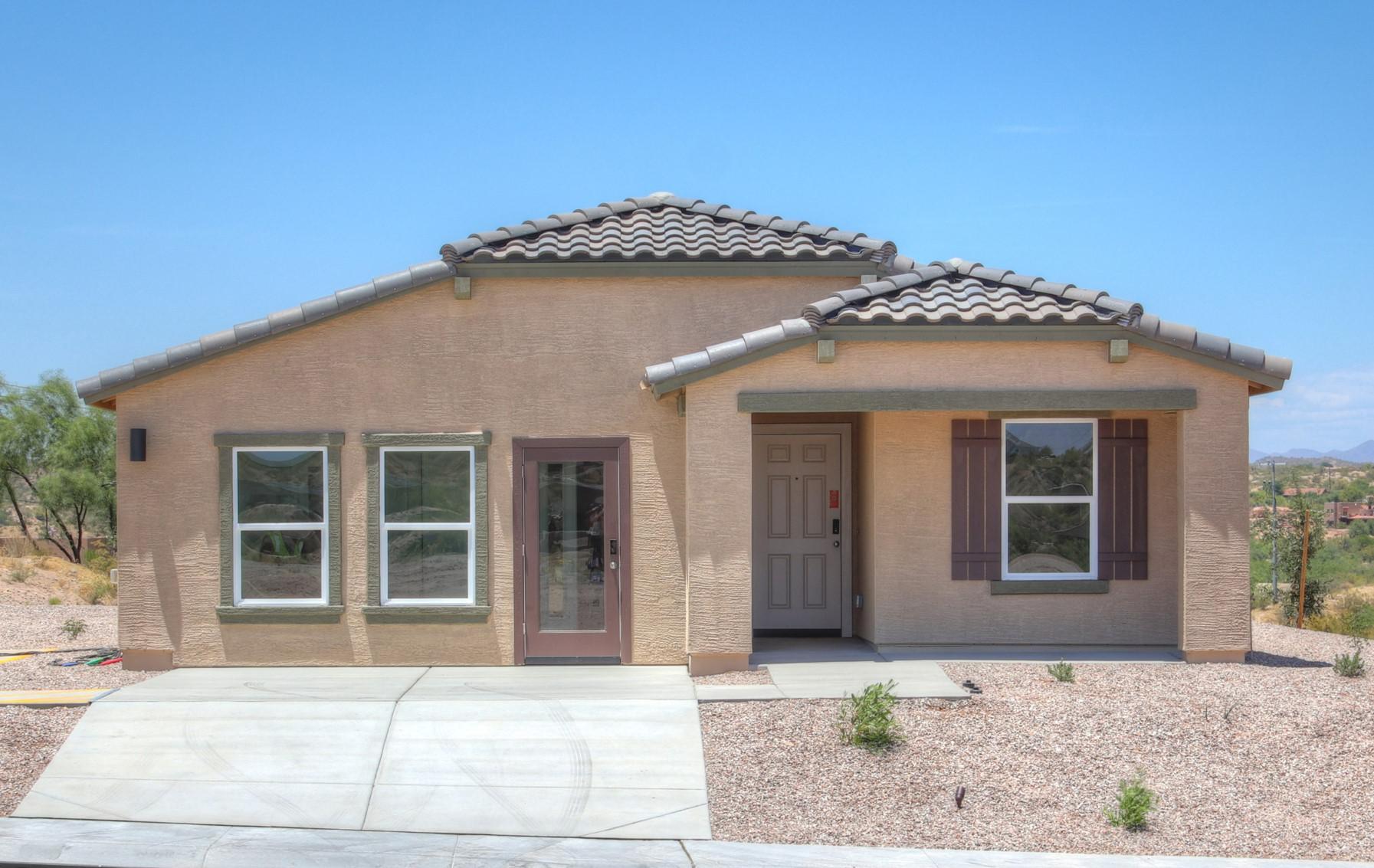 A house with a stone patio.