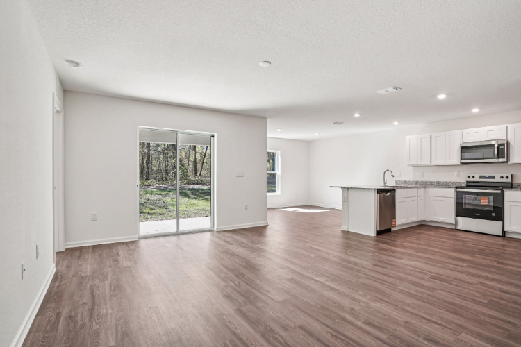 A large kitchen with white cabinets.