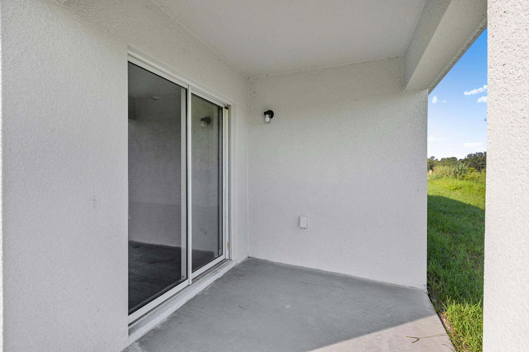 A white building with glass doors.