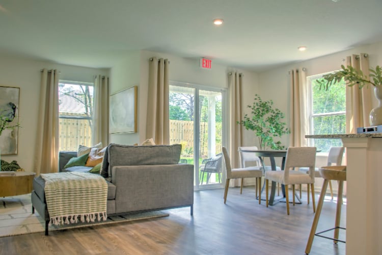A living room with a wood floor.
